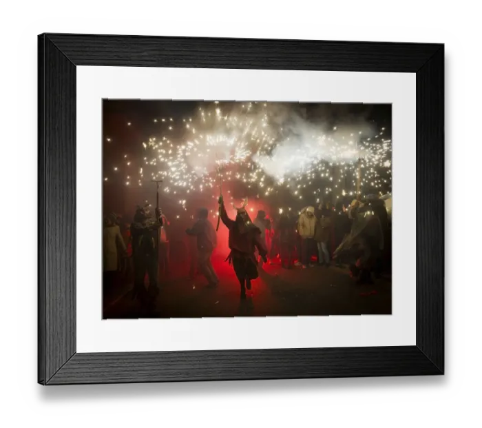 Framed Print : A reveller wearing a demon costume takes part in the traditional festival of Correfoc