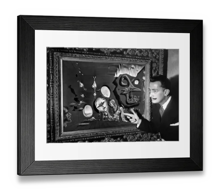 Framed Print : Salvador Dali poses in front of one his paintings Framed Print : Salvador Dali poses in front of one his paintings