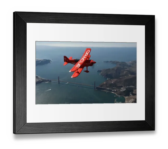 Framed Print : Team Oracle stunt pilot Sean Tucker flies over the Golden Gate bridge as part of Framed Print : Team Oracle stunt pilot Sean Tucker flies over the Golden Gate bridge as part of