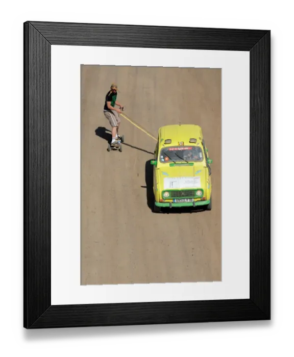 Framed Print : A man on a skate board is pulled by a 4L before the stage from Boudnib to Merzouga Framed Print : A man on a skate board is pulled by a 4L before the stage from Boudnib to Merzouga