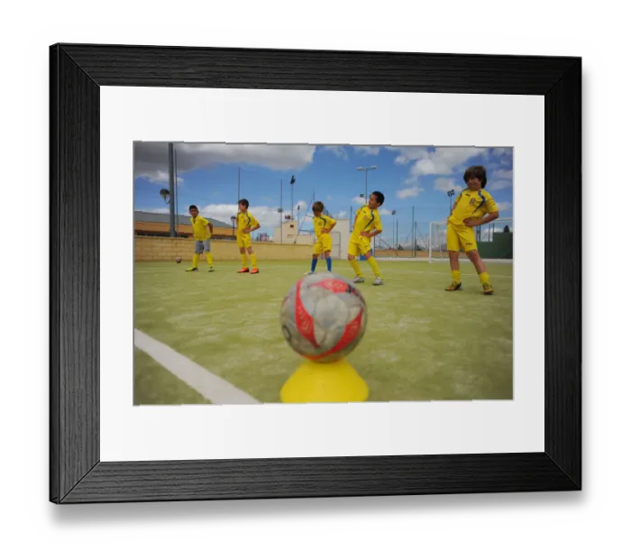 Framed Print : Young players of the Ronda Union Deportiva football club take part in a training Framed Print : Young players of the Ronda Union Deportiva football club take part in a training