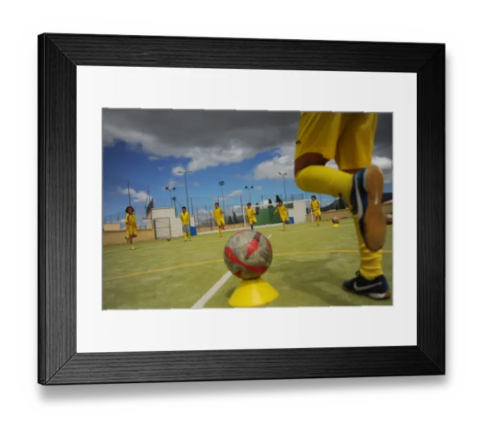 Framed Print : Young players of the Ronda Union Deportiva football club take part in a training