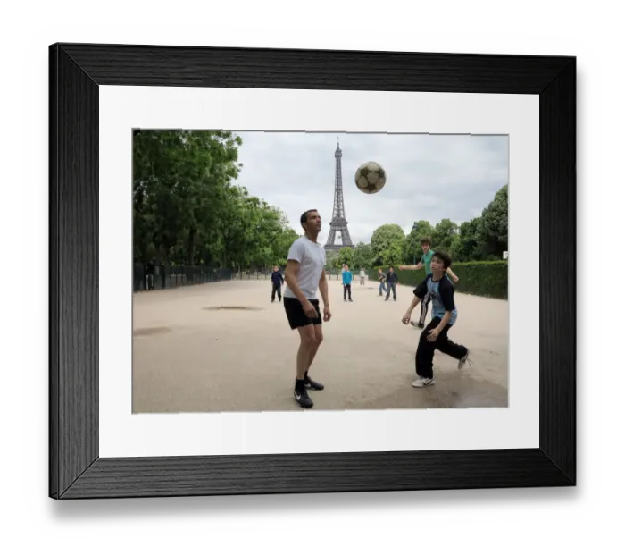 Framed Print : People play football on May 29, 2014 in front of the Eiffel tower, in Paris Framed Print : People play football on May 29, 2014 in front of the Eiffel tower, in Paris