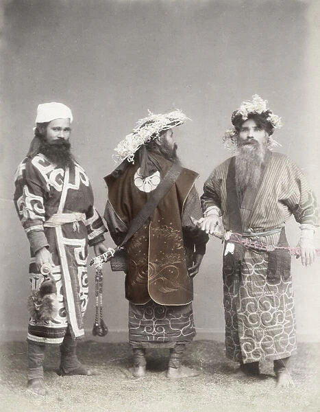 Ainu men with swords in a studio setting, Japan