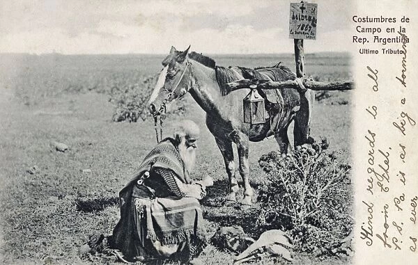 Argentinian traveller paying respects at grave of a gaucho