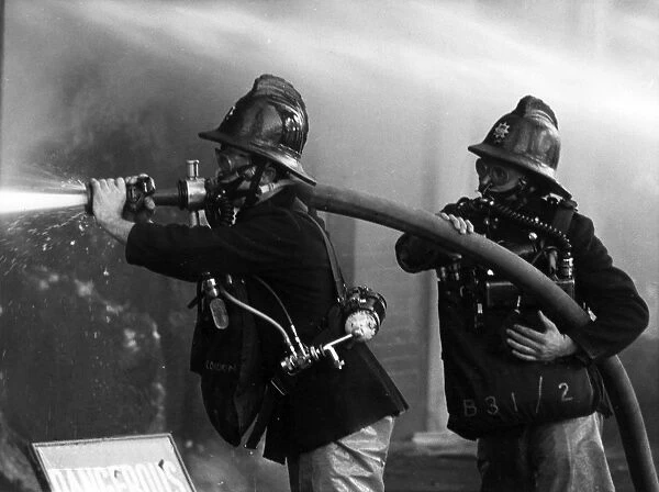 Two firefighters at King George V Dock, East London