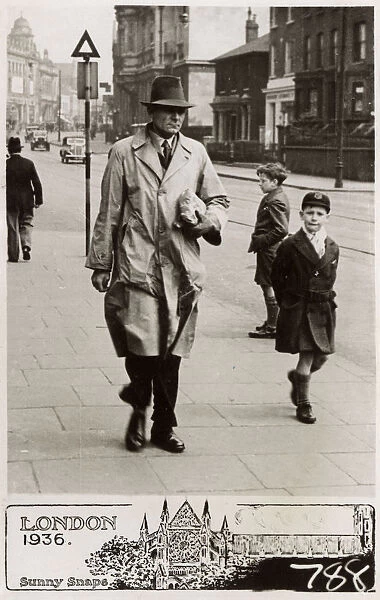 Gent in Raincoat and young schoolboy (his son?) - London