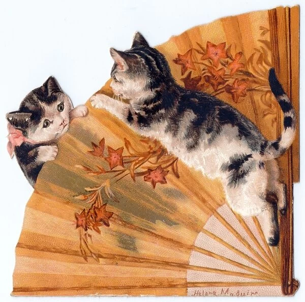 Two kittens on a cutout greetings card