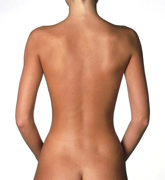 View of a standing womans naked back