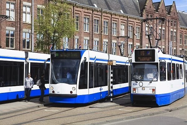 Centraal Station and trams, Amsterdam, Netherlands, Europe