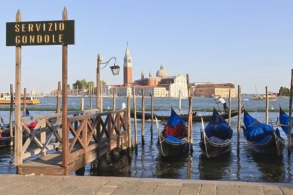 Gondolas moored on the Lagoon, San Giorgio Maggiore beyond, Riva degli Schiavoni