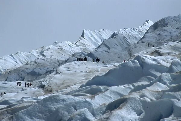 Tourists trekking on Moreno Glacier, Los Glaciares National Park, UNESCO World Heritage Site