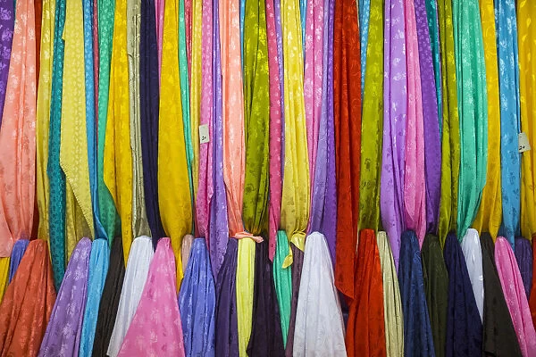 Colourful cotton fabrics for sale in Souk Waqif, Doha, Qatar