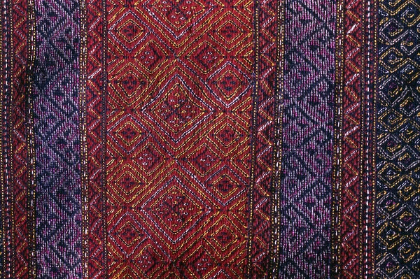 BANGLADESH, Crafts, Textiles Detail of red and purple woven murang pinon or loin cloth