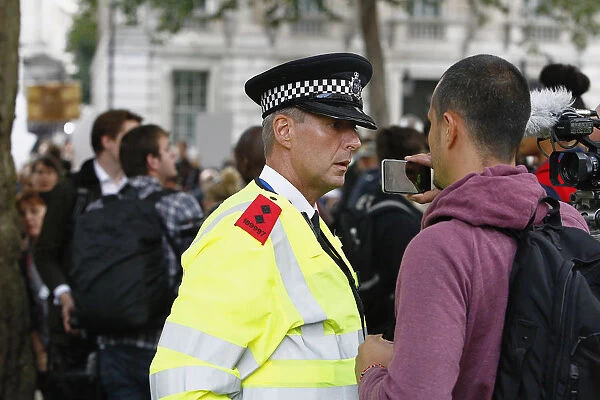 England, London, Westminster, Brexit demonstrations, protestor recording policeman with mobile phone
