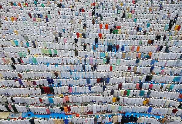 Muslims offer Eid al-Fitr prayers marking the end of the holy fasting month Ramadan in