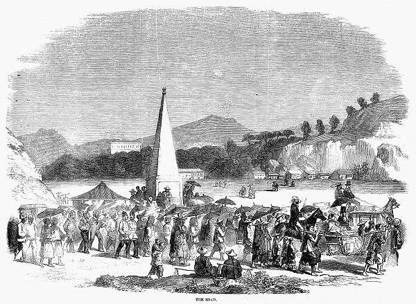 HONG KONG: ROAD TRAVEL. Crowds in Hong Kong on their way to a horse racing event in 1858. Contemporary English wood engraving