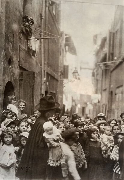 WWI: REFUGEES, c1919. An American Red Cross nurse with refugee children in the Rue St