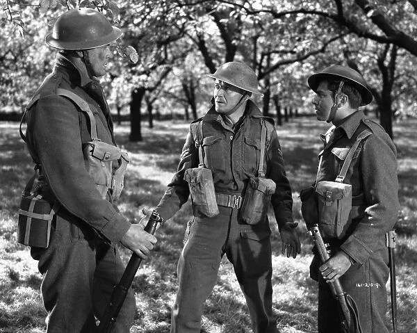 John Mills as Corporal Tubby Bins assesses the situation in the French countryside