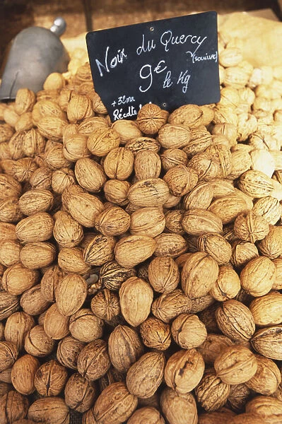 France, Quercy, walnuts on sale at market stall