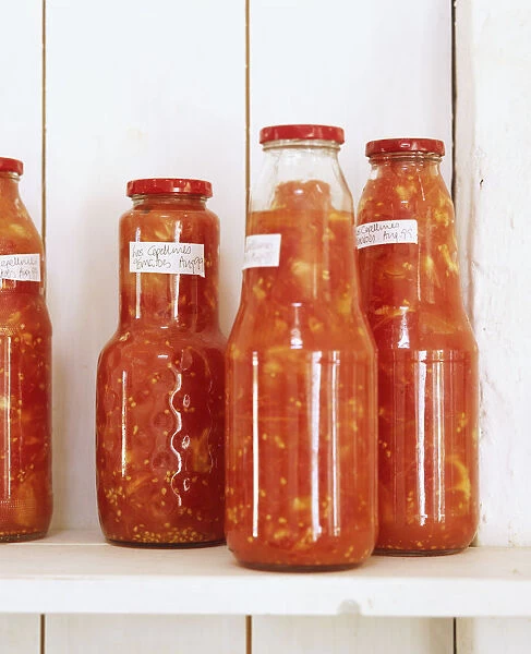 Recycled glass jars containing home-made tomato relishes