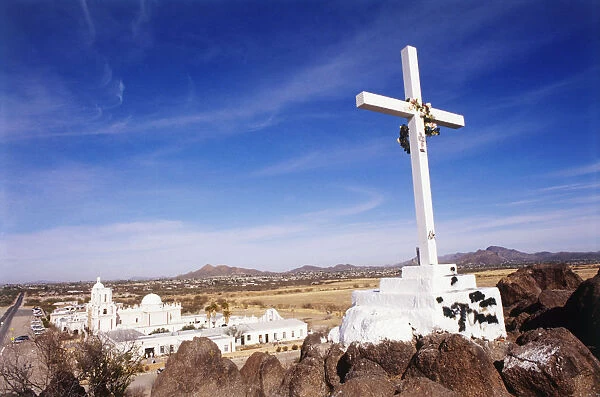 USA, Arizona, nr Tuscon, Santa Cruz Valley, cruxifix on hill overlooking San Xavier del Bac mission