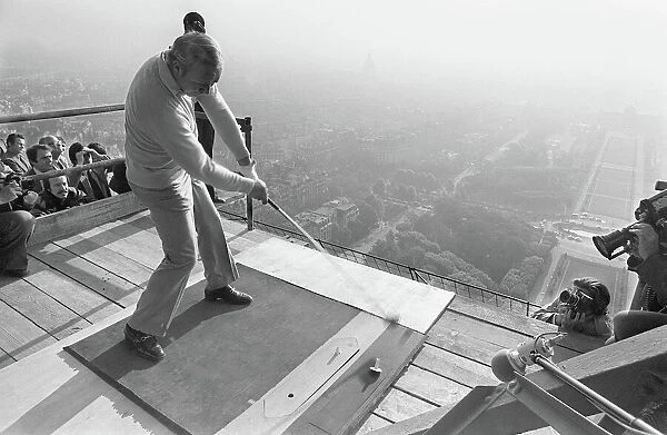 American Golfer Arnold Palmer kicks off from the second floor of the Eiffel Tower