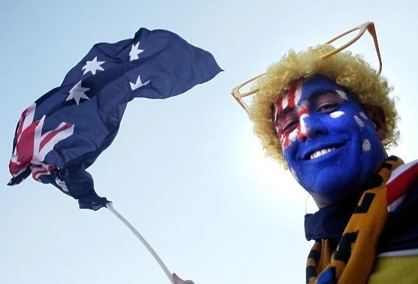 Australia- Flag-Fan. An Australian football team supporter poses with the country's flag