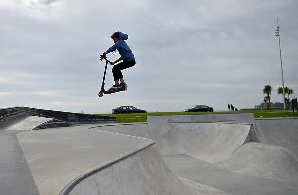 A boy rides a scooter in a skate park on October 7, 2016 in Saint-Nazaire, western France