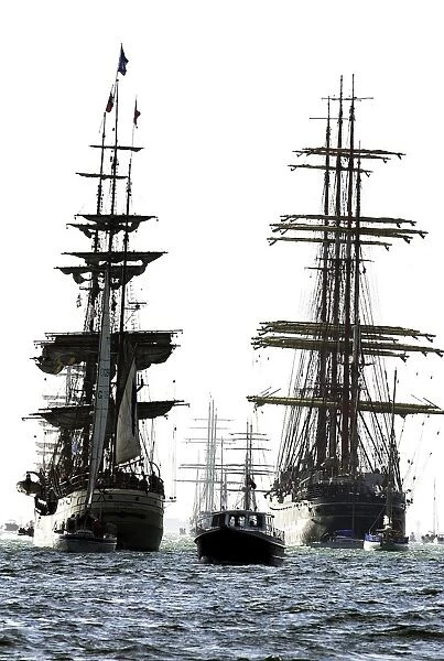Britain-Tall Ships. Two tall ships make their way out into the Solent to