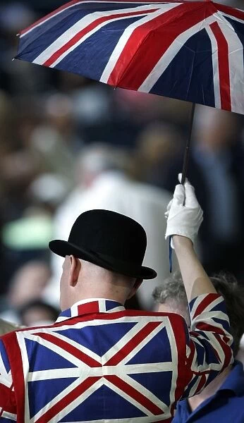 British-Flag-Music. A British music fan is pictured holding an umbrella