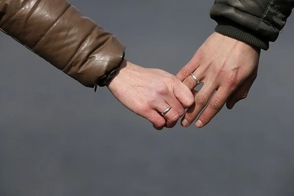 A coupe hold hands at the Uzquiza dam near Burgos, on February 16, 2014