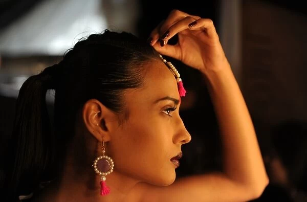 Fashion-India-Wills. A model prepares for a show backstage during the Wills