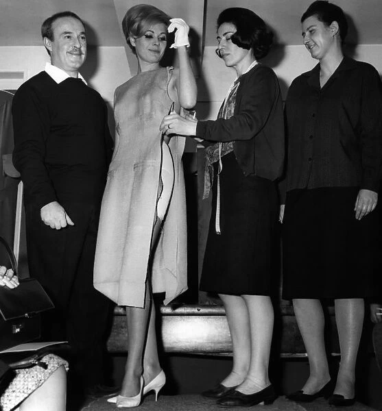 fra-fashion-esterel. Designer Jacques Esterel poses dress-makers adjusting