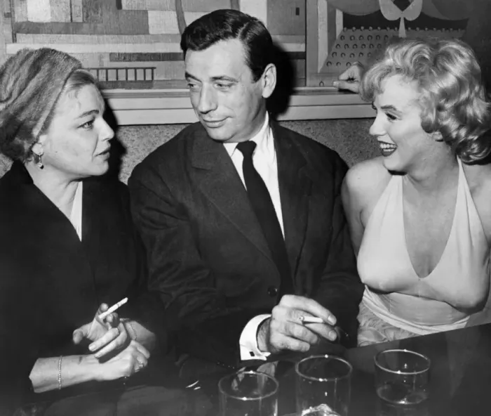 Framed Print : French actors Simone Signoret and her husband Yves Montand Chat with American Star Marilyn Monroe