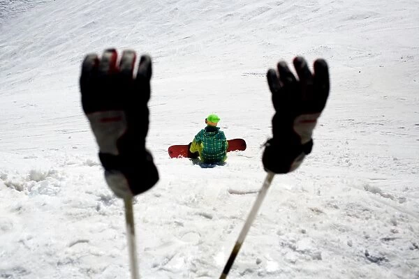 Iran-Ski-Tourism. A Skier takes a break on a slope at the Darbandsar ski resort