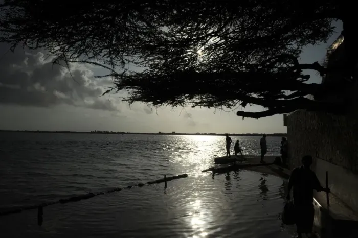 Framed Print : Lamu residents stand at the beach on October 2, 2011 at Ras Gitau, in Manda, Lamu archipelago Framed Print : Lamu residents stand at the beach on October 2, 2011 at Ras Gitau, in Manda, Lamu archipelago