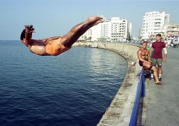 Lebanon-Weather. A Lebanese man jumps into the sea 09 July 2000