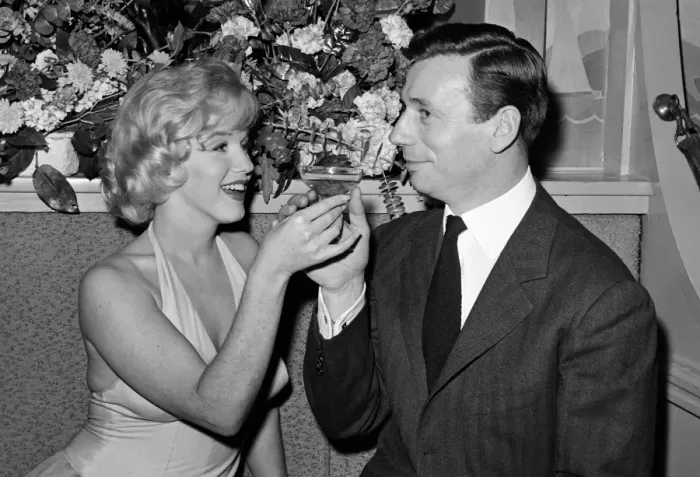 Framed Print : Marilyn Monroe and her co-star, French actor and singer Yves Montand