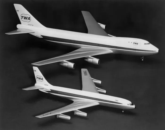 Framed Print : Two models of Boeing planes are compared : Boeing 747 (top) is two and a half times
