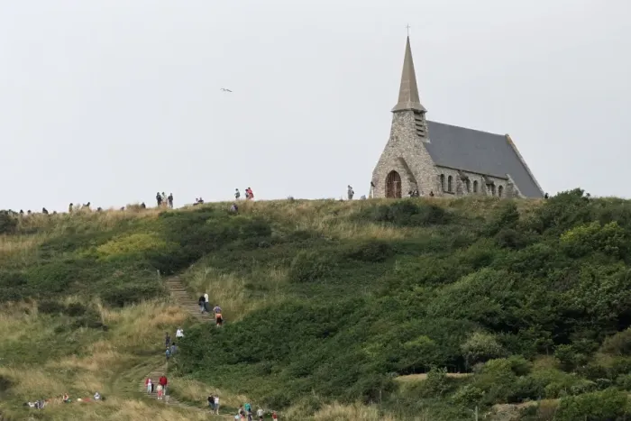 Framed Print : The Notre-Dame-de-la-Garde chapel, perched on the cliffs of Etretat, is pictured on July 20 Framed Print : The Notre-Dame-de-la-Garde chapel, perched on the cliffs of Etretat, is pictured on July 20