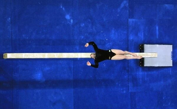 Oly2000-Gym-Feature. An unidentified gymnast performs on the beam 17 September
