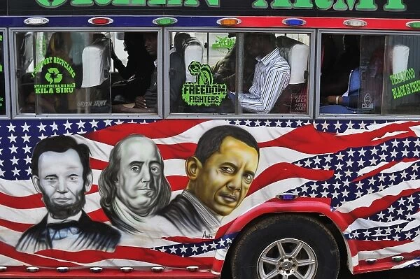 People sit in a matatu minibus with a painting depicting US Presidents Abraham Lincoln