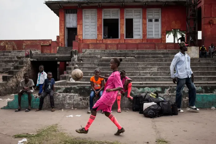 Framed Print : A player juggles before a match in Kinshasa on April 11, 2015. AFP PHOTO / FEDERICO SCOPPA Framed Print : A player juggles before a match in Kinshasa on April 11, 2015. AFP PHOTO / FEDERICO SCOPPA