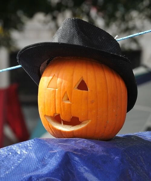 A pumkin wearing a hat sits atop an Occupy DC tent in McPherson Square on October 31