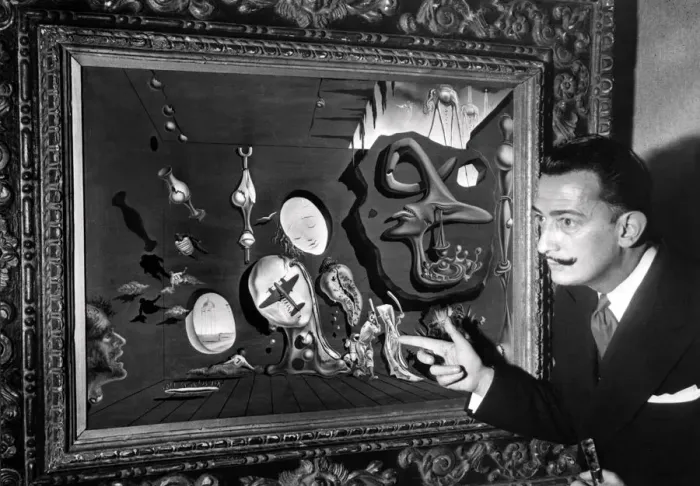 Framed Print : Salvador Dali poses in front of one his paintings Framed Print : Salvador Dali poses in front of one his paintings