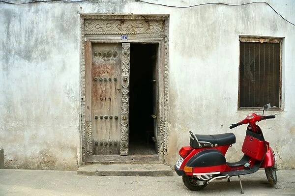 Stone Town Zanzibar. A scooter is parked by a house in Stone Town in Zanzibar on January 7