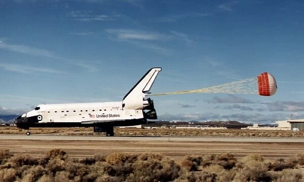 Us-Discovery Lands. The Space Shuttle Discovery is slowed down by its drag