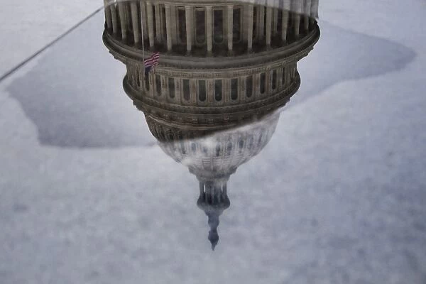 Us-Politics-Capitol. The National Capitol is reflected upside down in a
