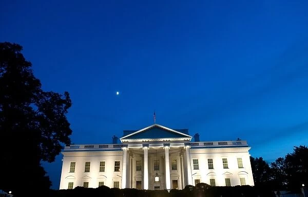 Us-White-House. The White House is seen at dusk as illuminated by lights